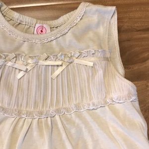 Sweet cream colored kid’s blouse.